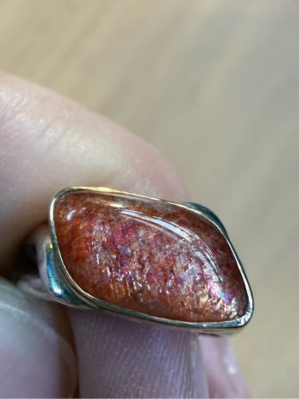 Sunstone gold and silver ring